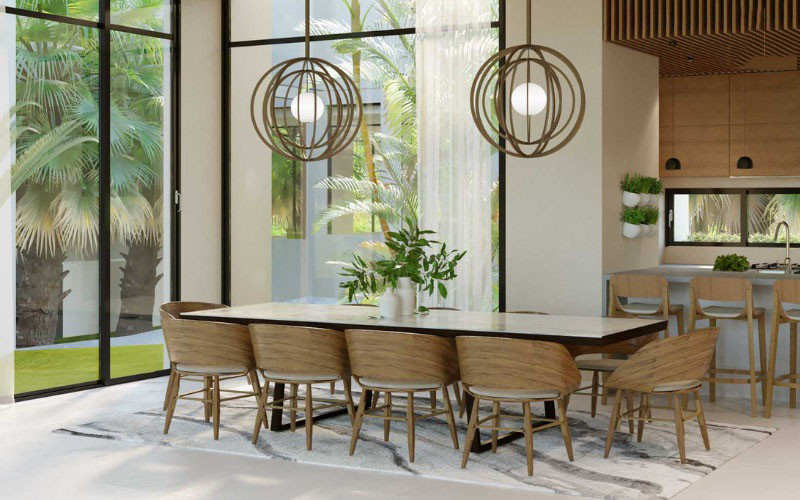 Bàn ăn cạnh cửa sổ trong phòng ăn biệt thự